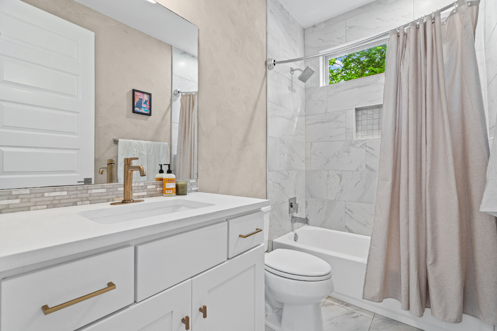 2906 Webberville Road, Unit 1 Austin, TX 78702 - Photo 11 of 23 a bathroom with a sink a toilet and shower