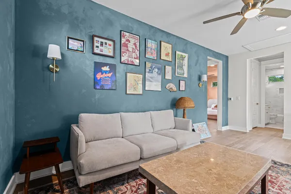 a living room with furniture and a rug