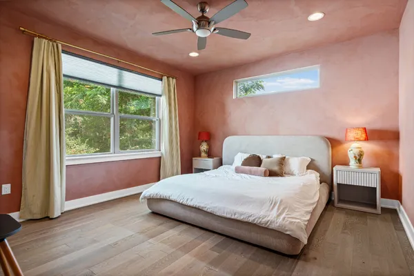 a bedroom with a bed and window