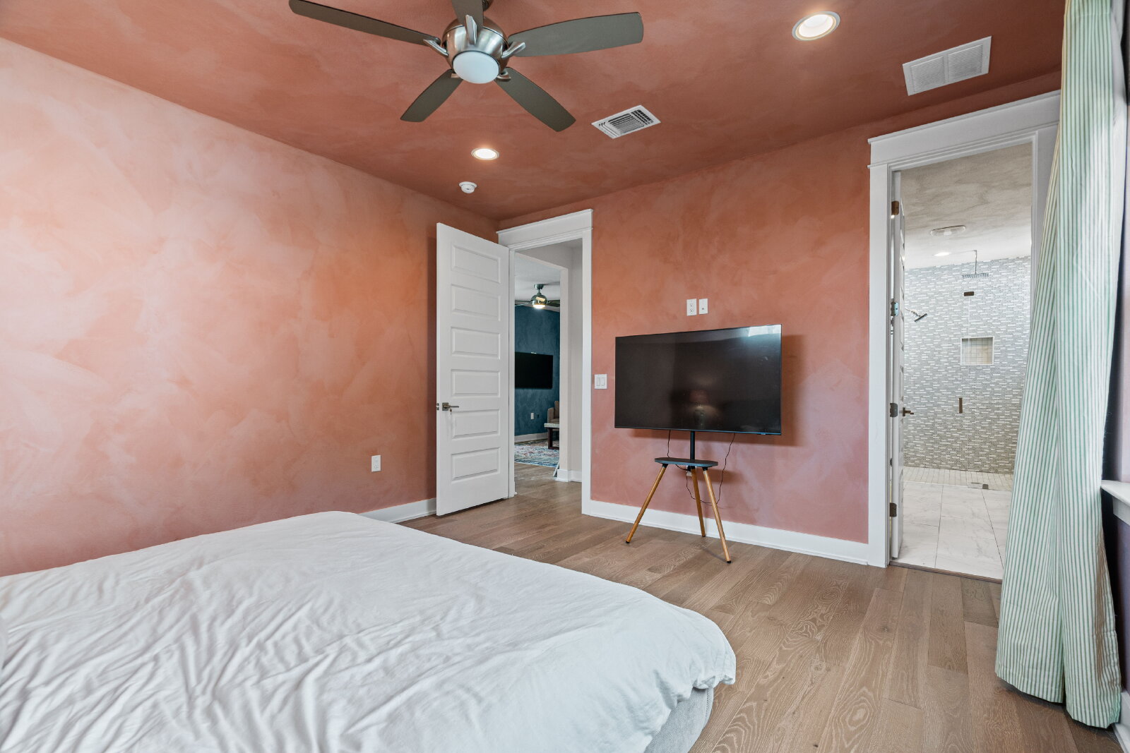 2906 Webberville Road, Unit 1 Austin, TX 78702 - Photo 15 of 23 a bedroom with a bed and a flat screen tv