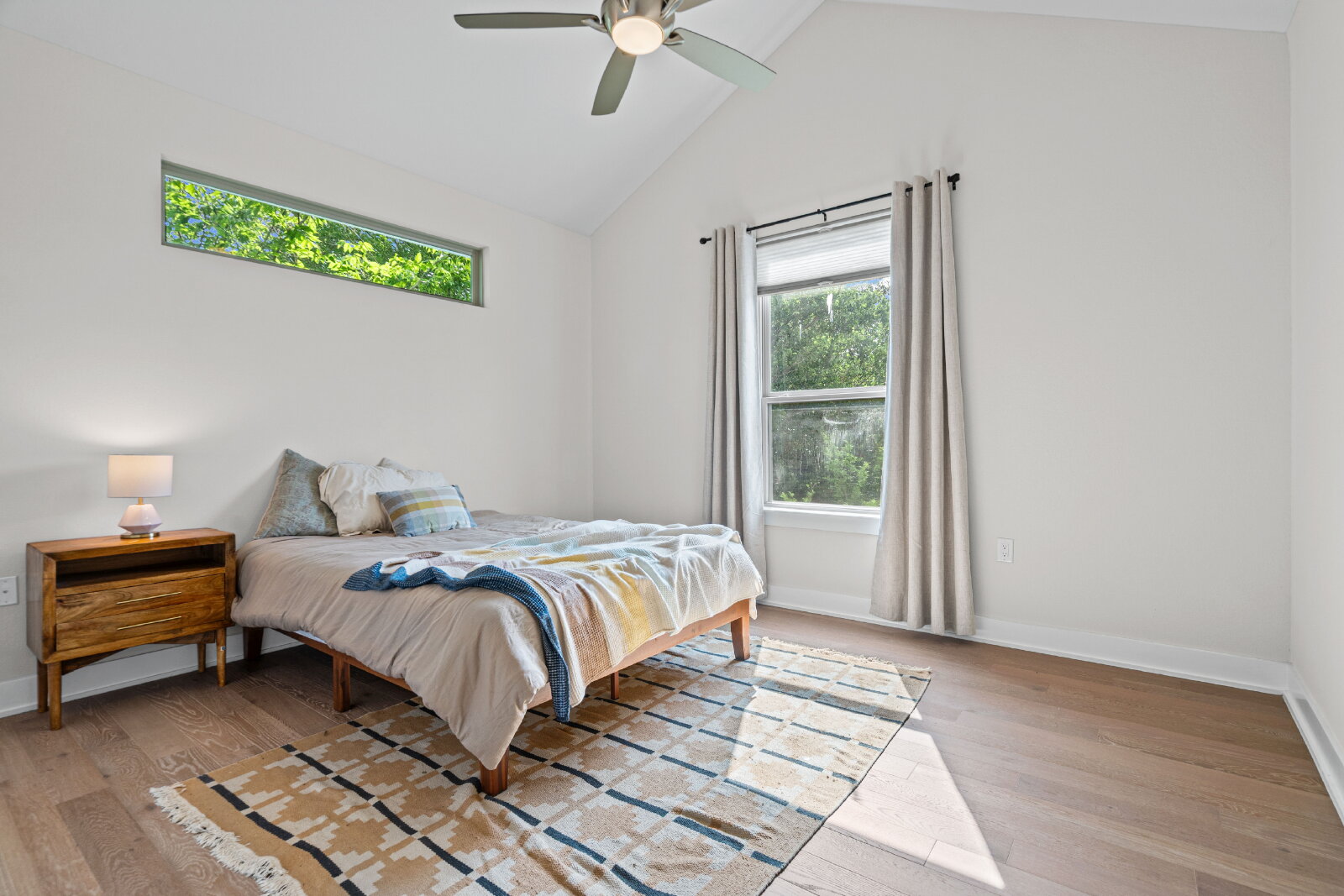 2906 Webberville Road, Unit 1 Austin, TX 78702 - Photo 18 of 23 a bedroom with a bed and a window