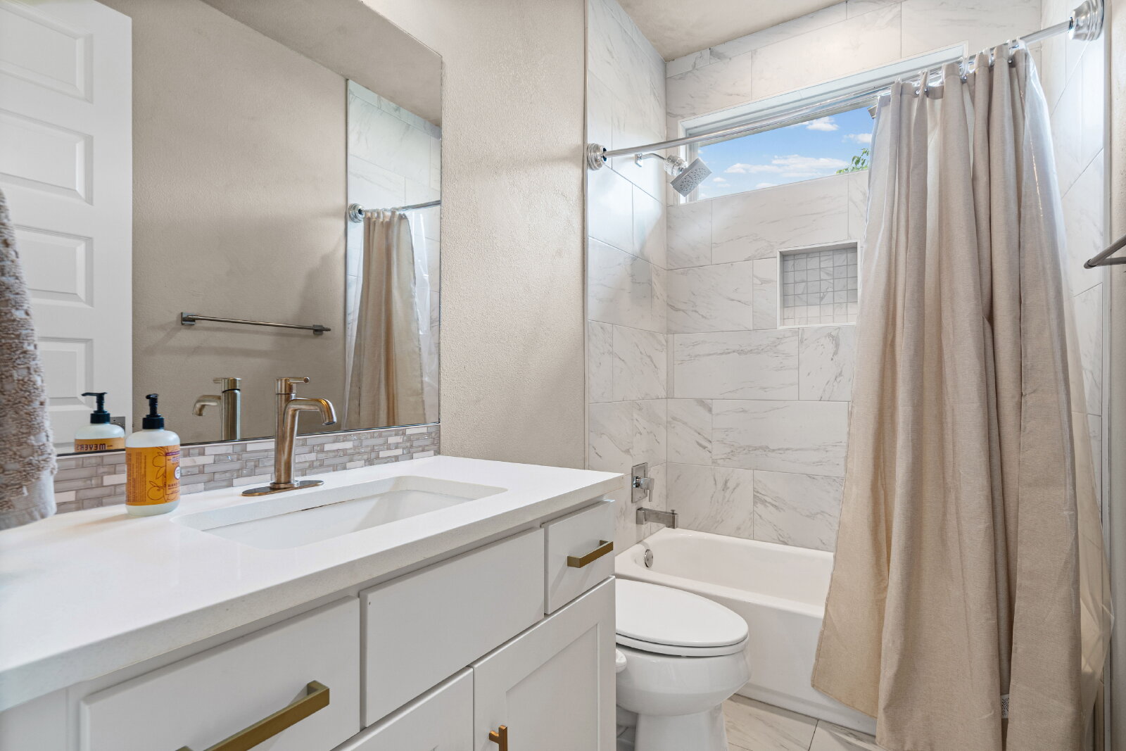 2906 Webberville Road, Unit 1 Austin, TX 78702 - Photo 19 of 23 a bathroom with a sink a toilet and shower