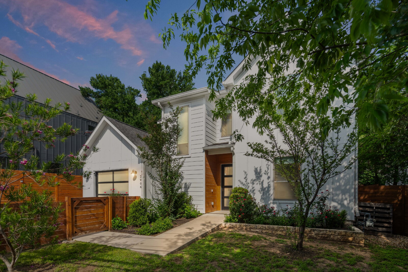 2906 Webberville Road, Unit 1 Austin, TX 78702 - Photo 20 of 23 front view of house with a yard