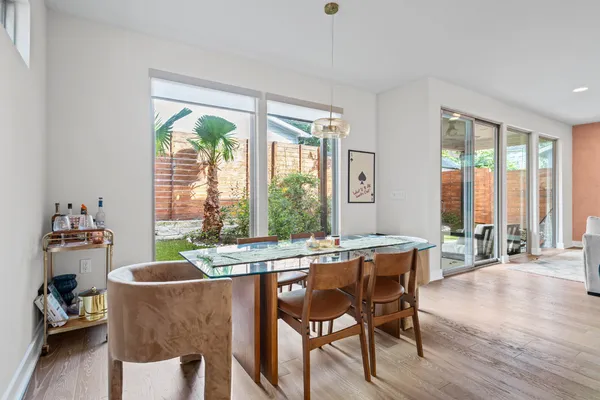 a dining room with furniture window wooden floor