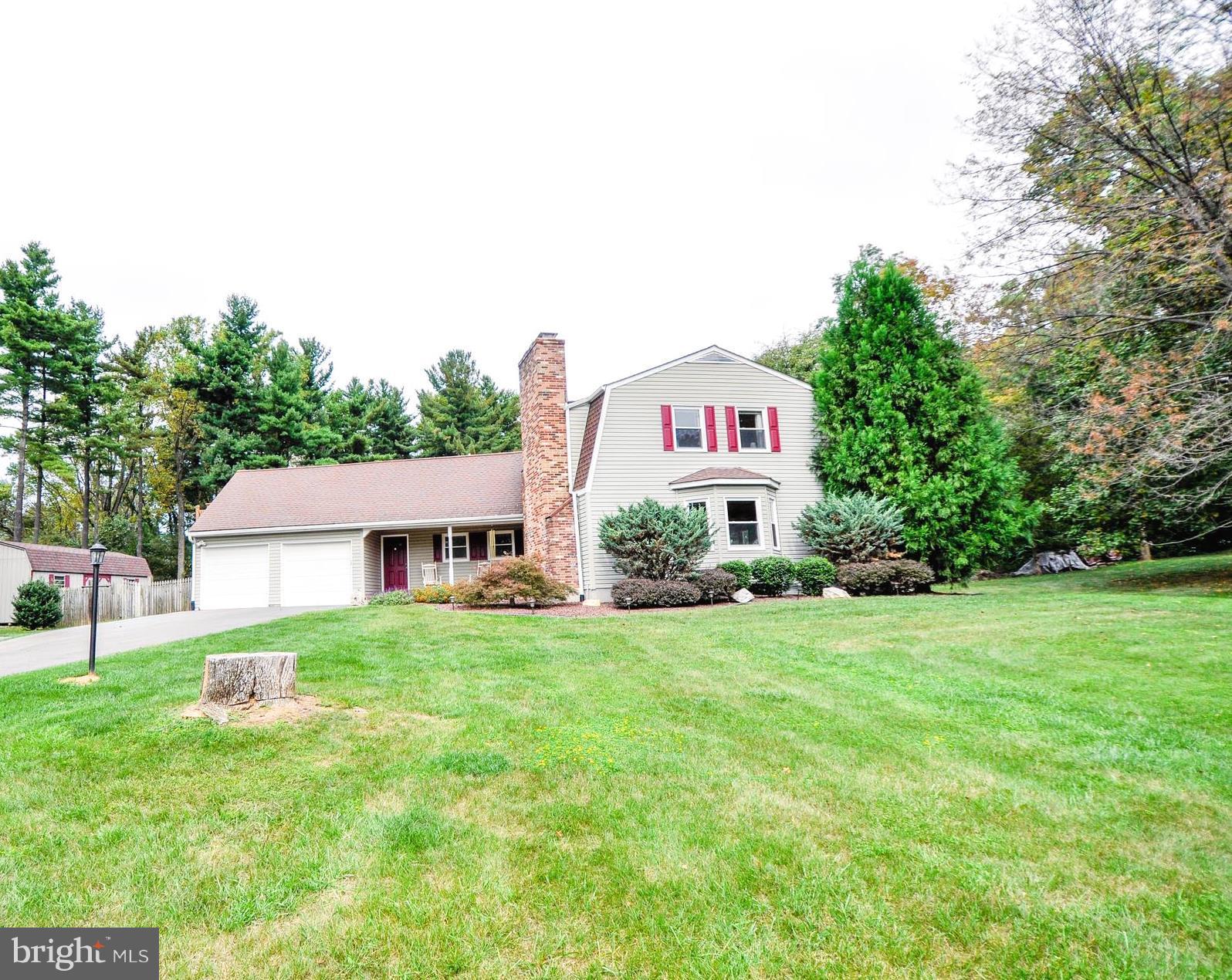 5502 Woodlyn Road Frederick, MD 21703 - Photo 1 of 30 a house view with a garden space