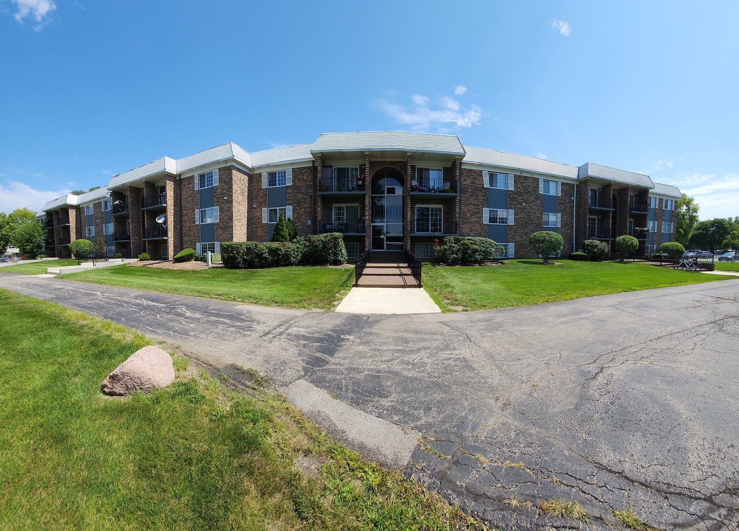 a view of a building with a yard