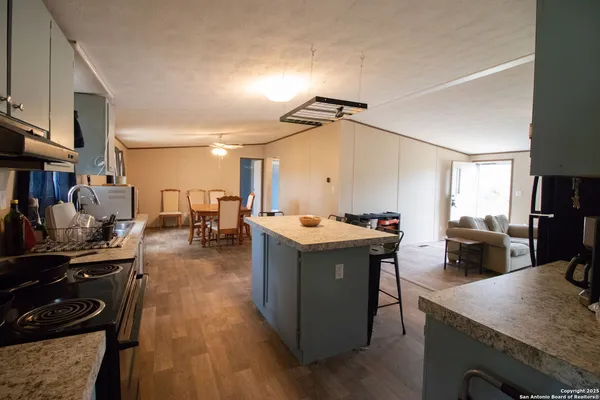 a kitchen with a stove and a refrigerator