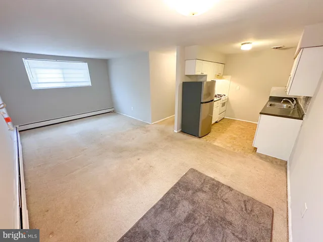 a view of a kitchen with a sink