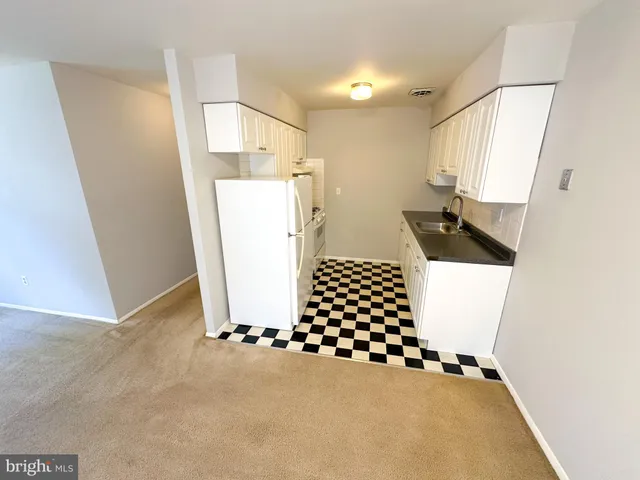 a view of an empty room and a window