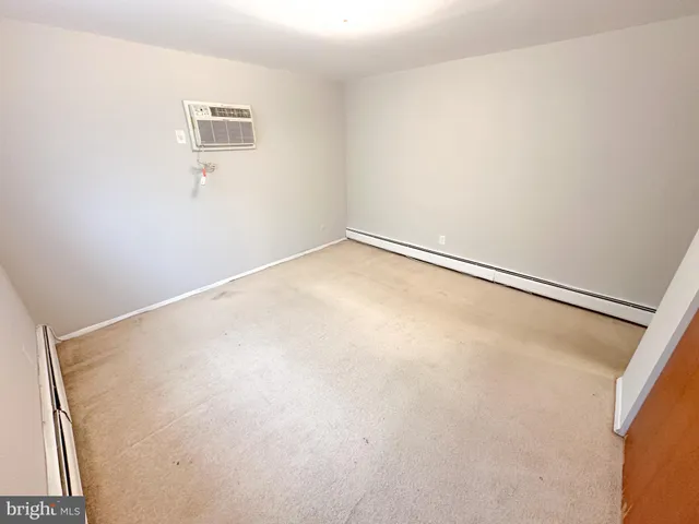 a view of a room with a refrigerator