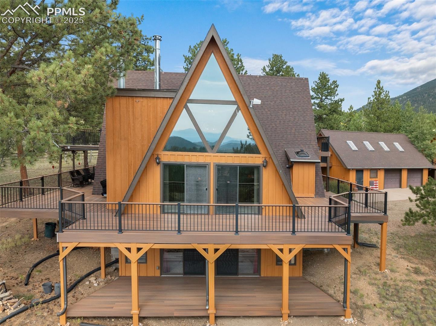 334 Pulver Road Lake George, CO 80827 - Photo 1 of 50 stunning street view of this amazing home. Notice the decking!