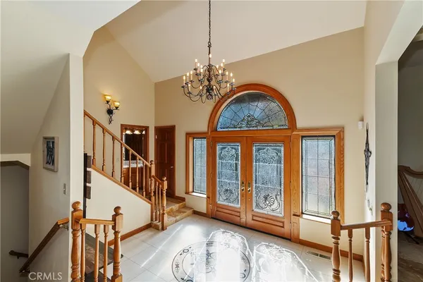 a view of entryway livingroom and hall with wooden floor