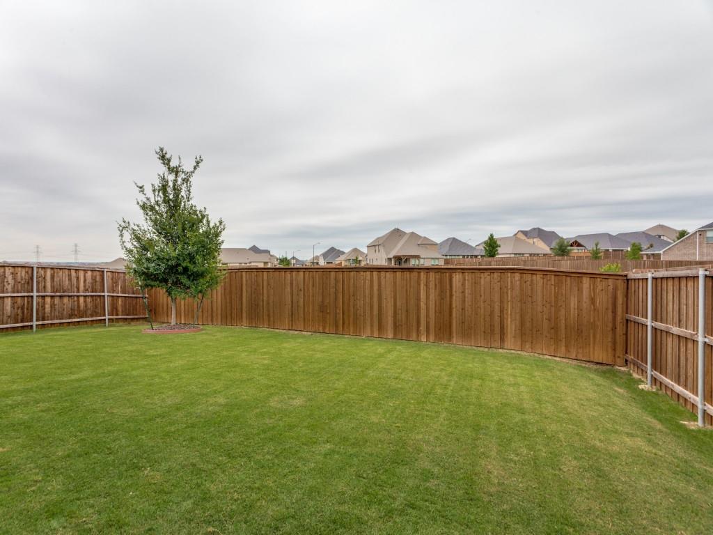 10613 Smiths Bnd Road Fort Worth, TX 76126 - Photo 26 of 29 Expansive backyard featuring a manicured lawn, full wood privacy fencing, and a mature tree