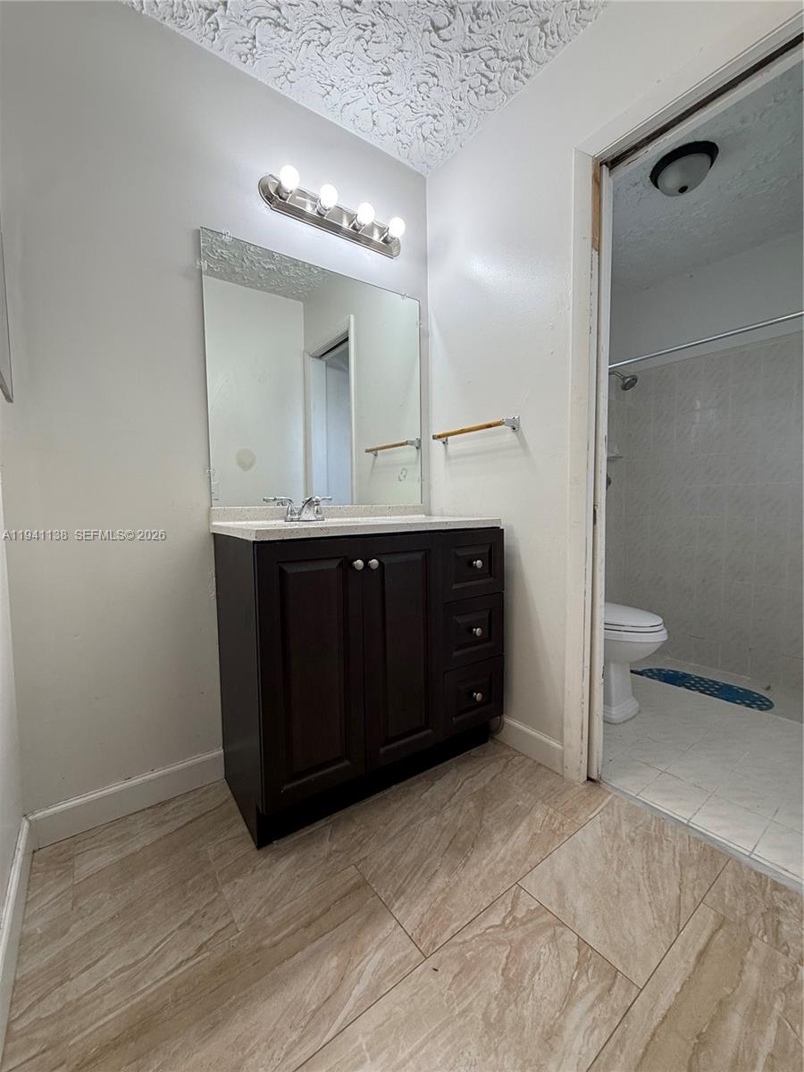 13628 Southwest 287th Lane Homestead, FL 33033 - Photo 11 of 17 a spacious bathroom with a sink and a mirror