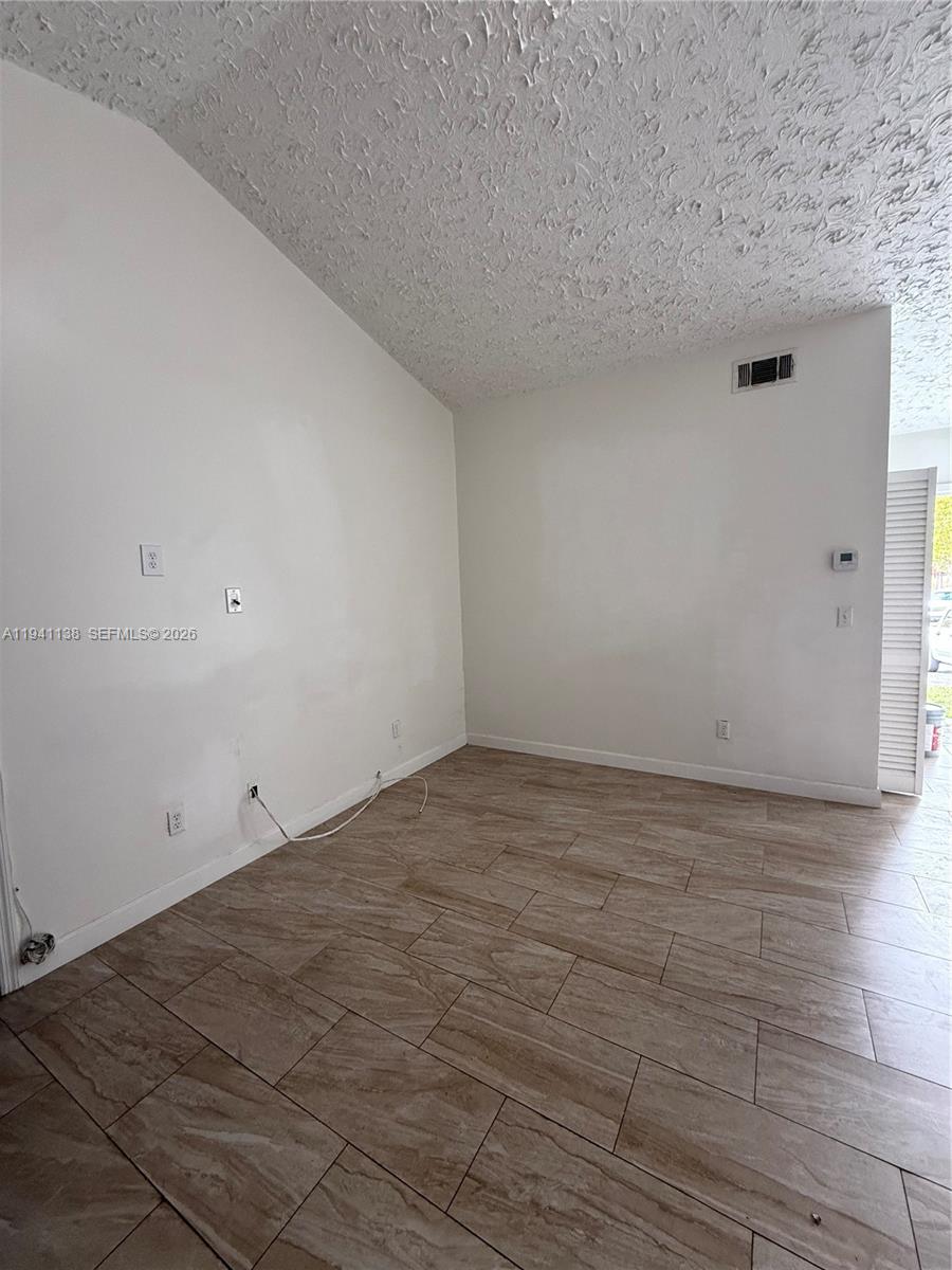 13628 Southwest 287th Lane Homestead, FL 33033 - Photo 12 of 17 a view of empty room