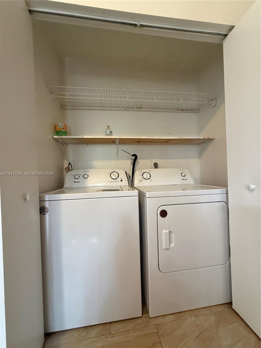 13628 Southwest 287th Lane Homestead, FL 33033 - Photo 17 of 17 a utility room with dryer and washer