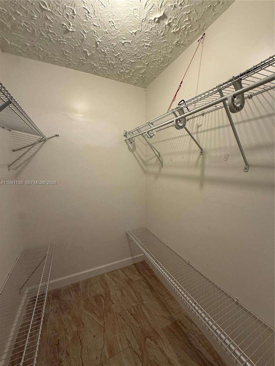 13628 Southwest 287th Lane Homestead, FL 33033 - Photo 7 of 17 a view of small space with racks on the wall