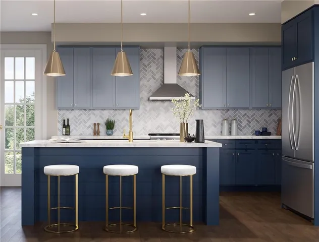 a kitchen with stainless steel appliances granite countertop a table chairs sink refrigerator and cabinets