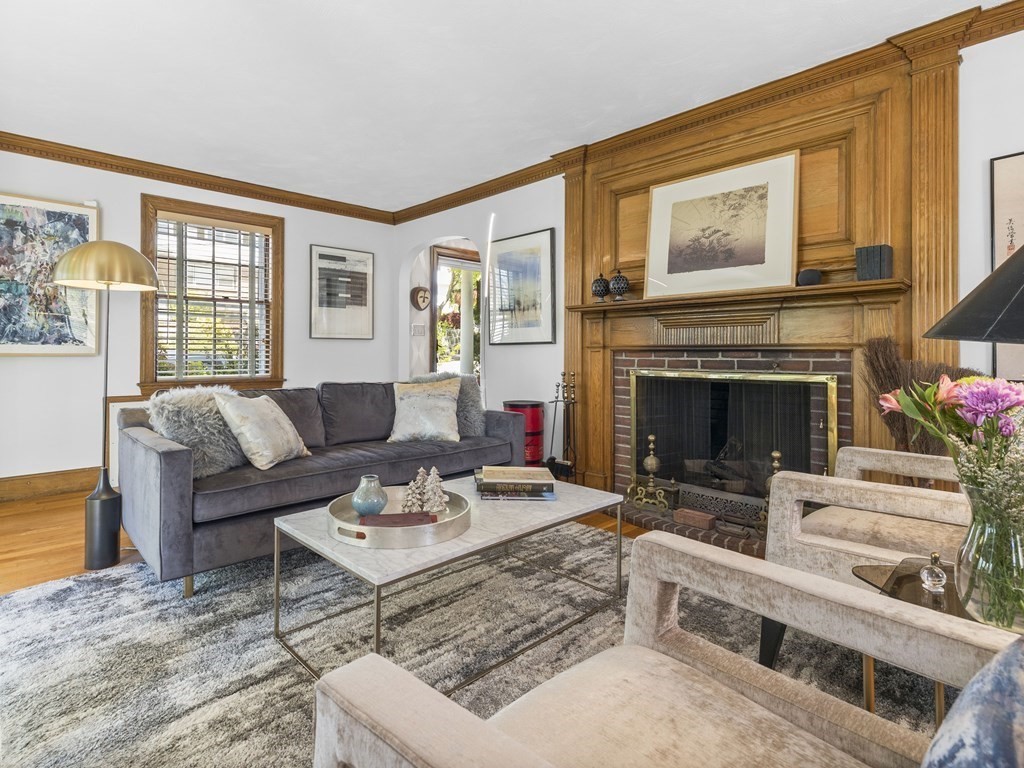 37 Crehore Road Boston, MA 02467 - Photo 1 of 30 a living room with furniture a fireplace and windows