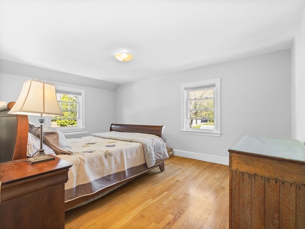 37 Crehore Road Boston, MA 02467 - Photo 14 of 30 a bedroom with a bed and a window