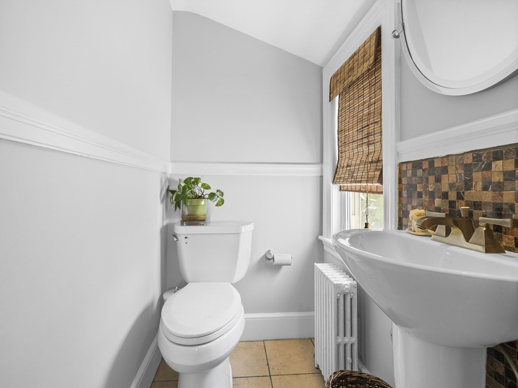 37 Crehore Road Boston, MA 02467 - Photo 17 of 30 a bathroom with a sink a toilet and a mirror