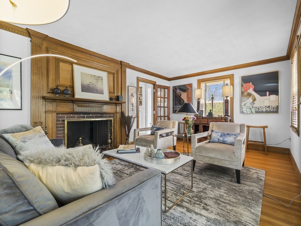 37 Crehore Road Boston, MA 02467 - Photo 2 of 30 a living room with furniture fireplace and a large window