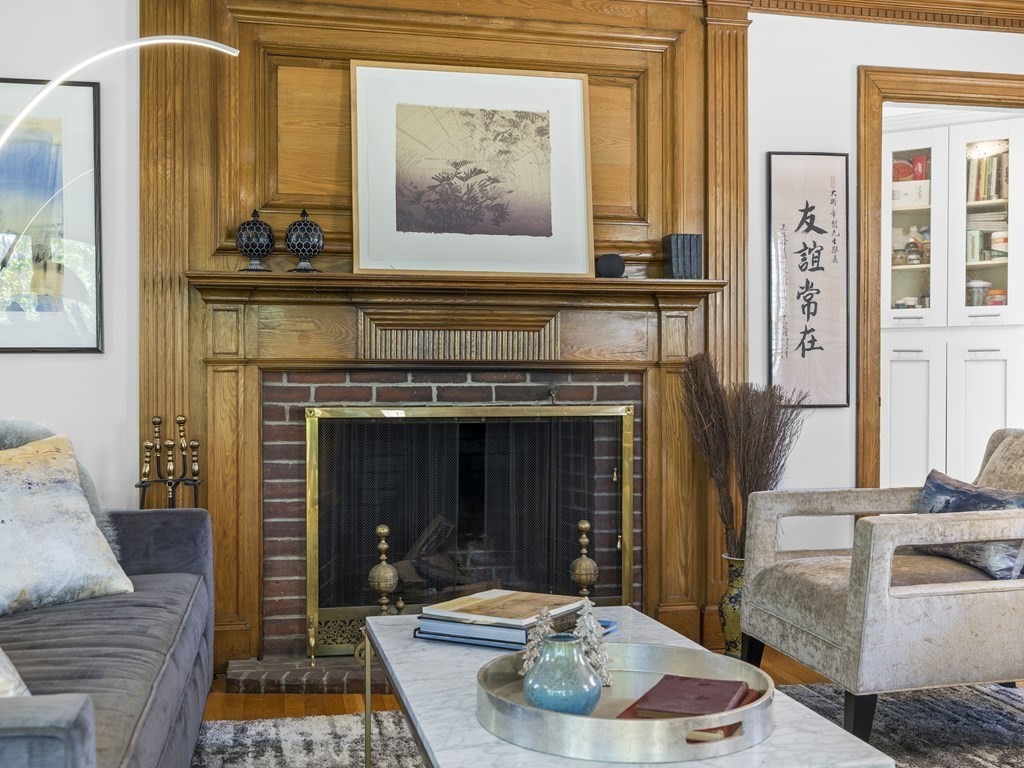 37 Crehore Road Boston, MA 02467 - Photo 3 of 30 a living room with furniture and a fireplace