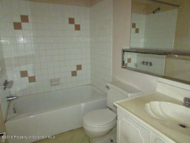 1707 Summit Pointe Scranton, PA 18508 - Photo 12 of 21 a bath room with a toilet sink and a bath tub