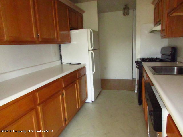 1707 Summit Pointe Scranton, PA 18508 - Photo 5 of 21 a kitchen with stainless steel appliances a refrigerator and a sink