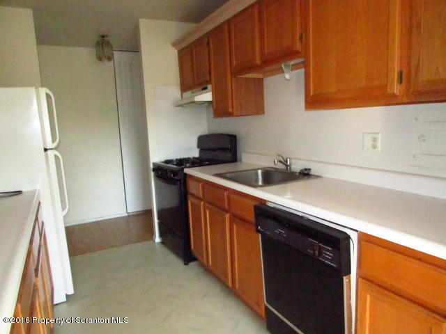 1707 Summit Pointe Scranton, PA 18508 - Photo 6 of 21 a kitchen with stainless steel appliances a sink stove and refrigerator