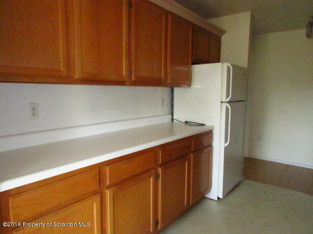 1707 Summit Pointe Scranton, PA 18508 - Photo 7 of 21 a kitchen with cabinets and stainless steel appliances