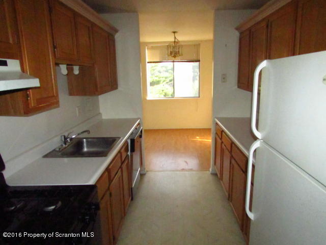 1707 Summit Pointe Scranton, PA 18508 - Photo 8 of 21 a kitchen with a sink and a refrigerator