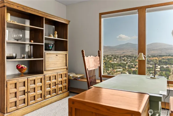 a bedroom with furniture and a window