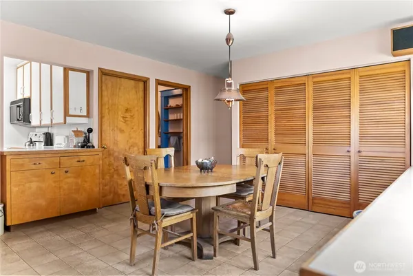 a dining room with furniture and window