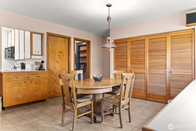 a dining room with furniture and window