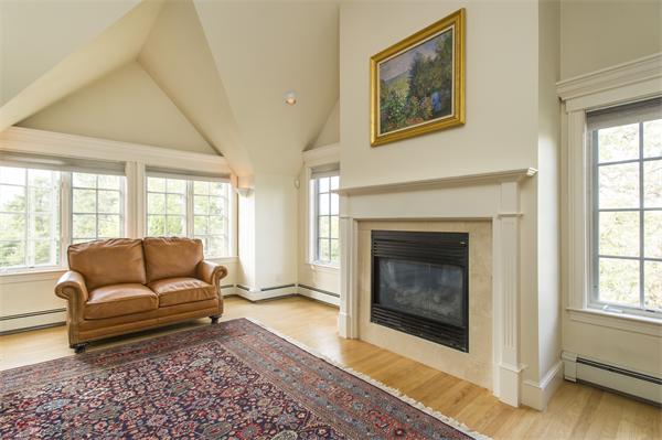 22 Chestnut Hill Road Newton, MA 02467 - Photo 17 of 30 a living room with furniture and a fireplace