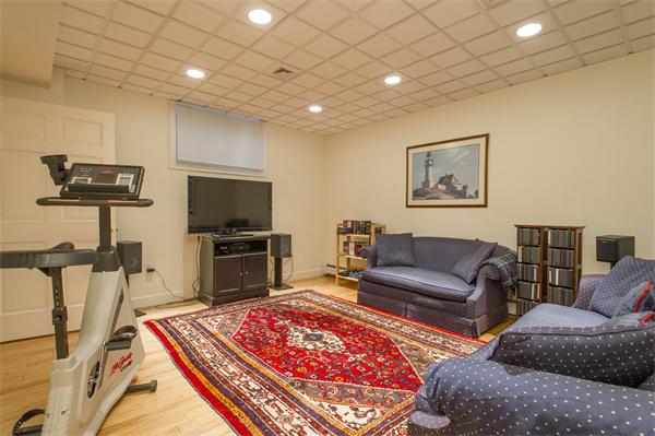22 Chestnut Hill Road Newton, MA 02467 - Photo 26 of 30 a living room with furniture and a flat screen tv