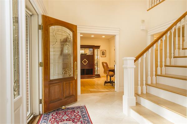 22 Chestnut Hill Road Newton, MA 02467 - Photo 3 of 30 a view of a hallway with wooden floor and furniture