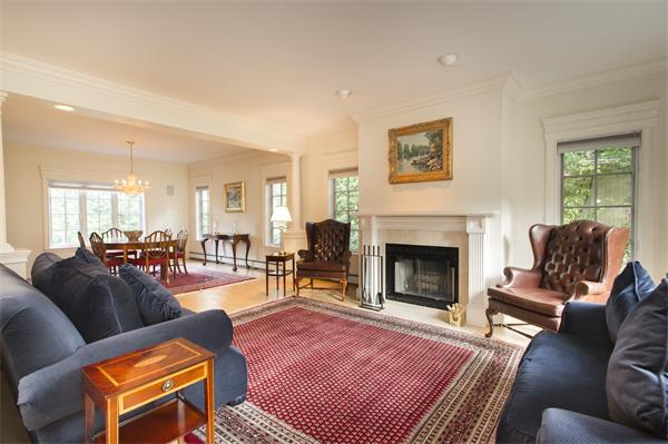 22 Chestnut Hill Road Newton, MA 02467 - Photo 4 of 30 a living room with furniture a fireplace and a window
