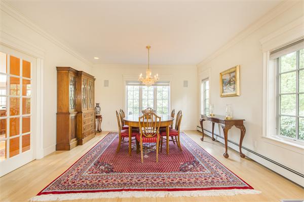 22 Chestnut Hill Road Newton, MA 02467 - Photo 6 of 30 a dining room with wooden floor and a rug