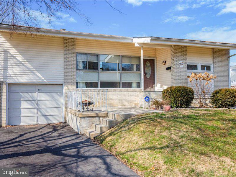a front view of a house with swimming pool