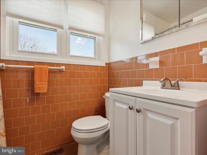 437 Haywood Road Ambler, PA 19002 - Photo 11 of 14 a bathroom with a sink a toilet and a mirror