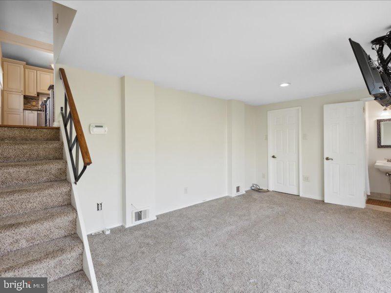 437 Haywood Road Ambler, PA 19002 - Photo 7 of 14 a view of an empty room with stairs