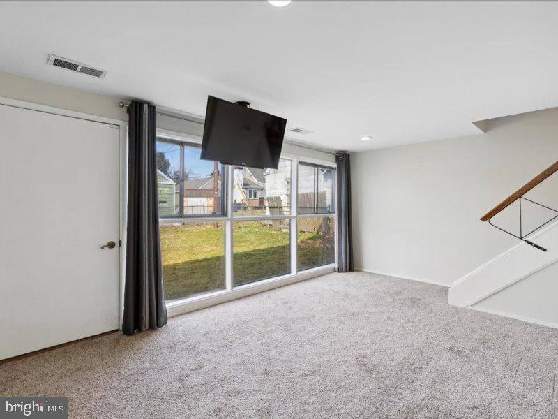 437 Haywood Road Ambler, PA 19002 - Photo 8 of 14 a view of a room with a flat screen tv and floor to ceiling window