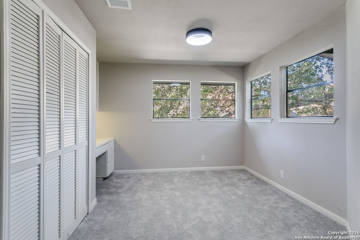 9380 Braun Road, Unit 501B San Antonio, TX 78254 - Photo 20 of 29 wooden floor in an empty room with a window
