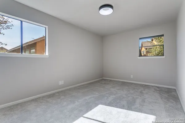 an empty room with windows