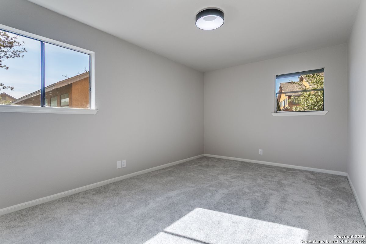 9380 Braun Road, Unit 501B San Antonio, TX 78254 - Photo 21 of 29 an empty room with windows