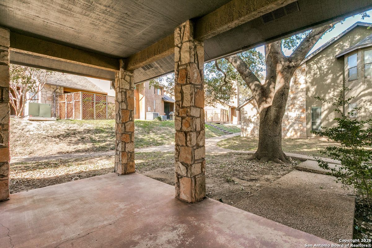9380 Braun Road, Unit 501B San Antonio, TX 78254 - Photo 26 of 29 a view of a porch with wooden floor and fence