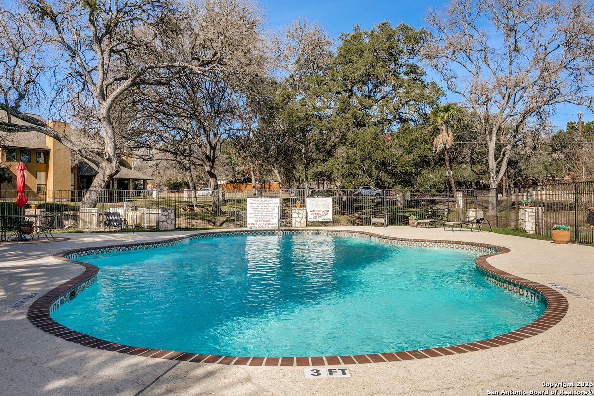 9380 Braun Road, Unit 501B San Antonio, TX 78254 - Photo 28 of 29 a view of a swimming pool with an outdoor seating