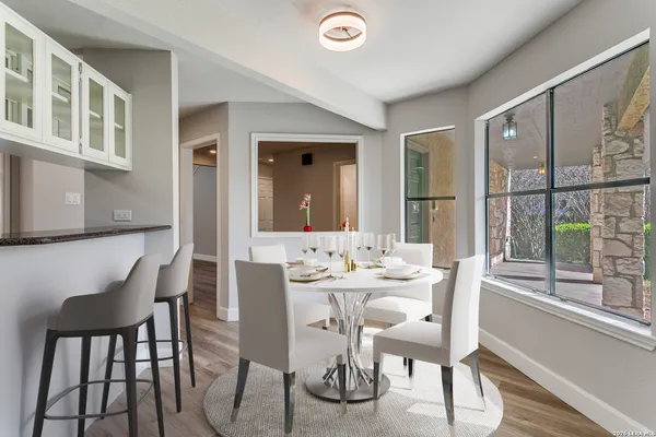 a dining room with furniture and window
